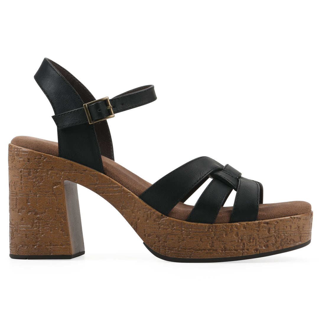 Side view of a black faux leather platform sandal with buckle style ankle strap and a brown molded cork sole