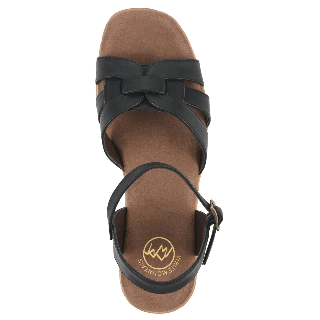 Top view of a black faux leather platform sandal with buckle style ankle strap and a brown molded cork sole