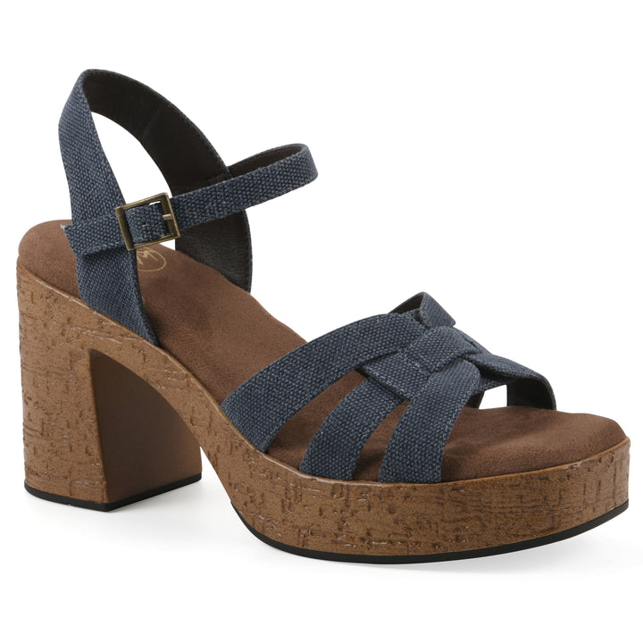 Angle view of a denim blue fabric platform sandal with buckle style ankle strap and a brown molded cork sole