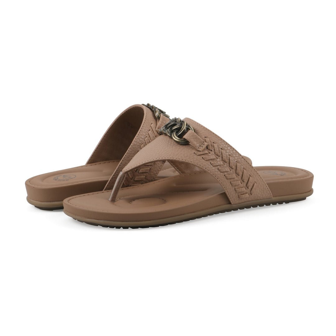 Angle view of a pair of tan thong sandals with metal embellishment and a brown sole