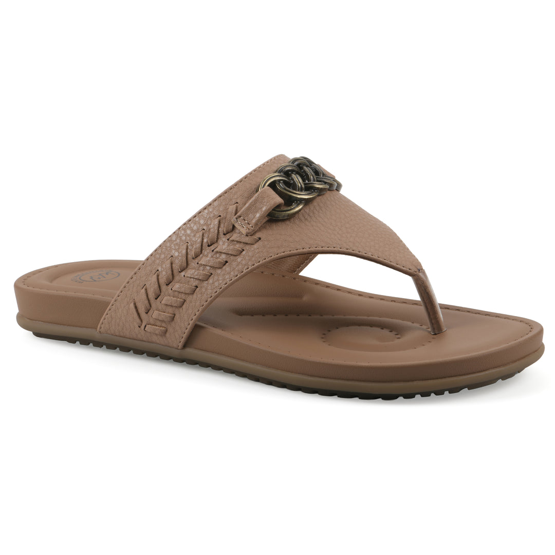Angle view of a tan thong sandal with metal embellishment and a brown sole