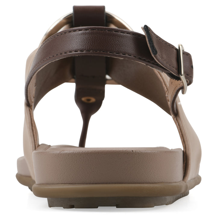 Rear view of a tan thong sandal with a centered metallic ring, adjustable heel strap, and beige sole