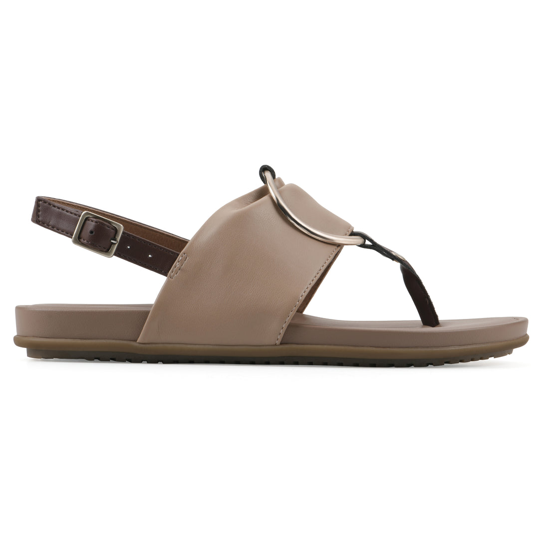 Side view of a tan thong sandal with a centered metallic ring, adjustable heel strap, and beige sole