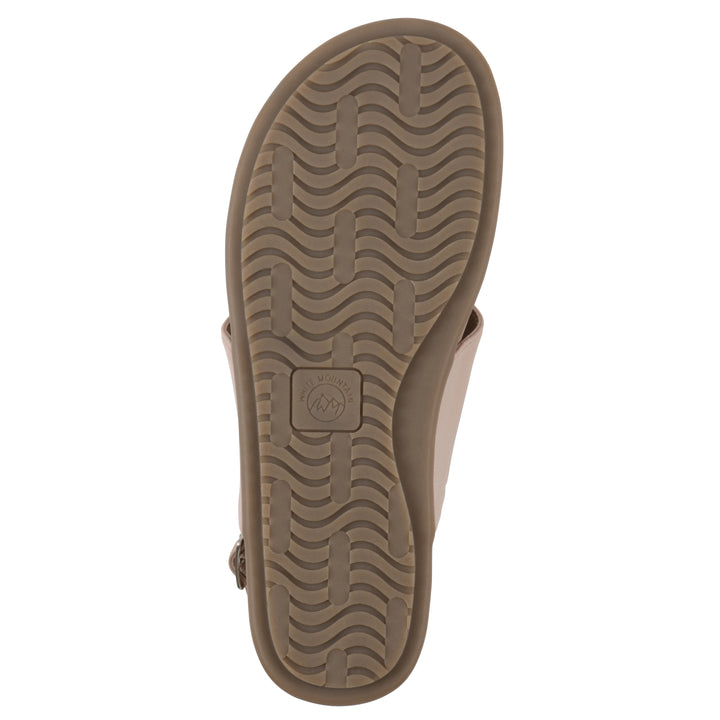 Sole view of a light beige thong sandal with a centered metallic ring, adjustable heel strap, and beige sole