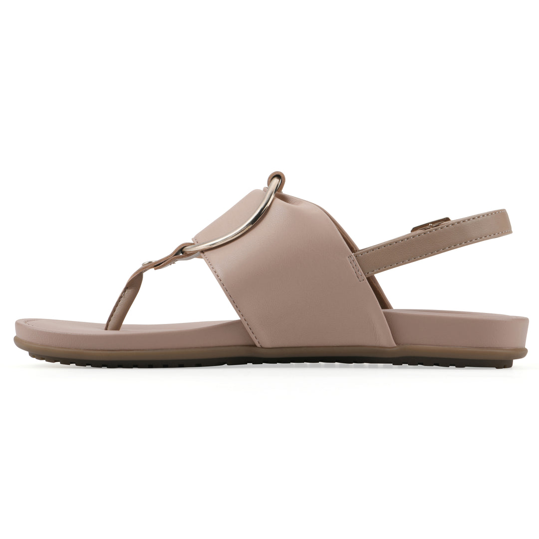 Side view of a light beige thong sandal with a centered metallic ring, adjustable heel strap, and beige sole