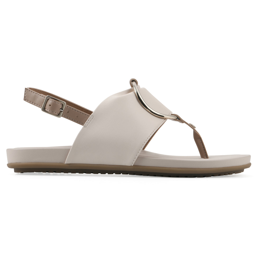 Side view of a cream thong sandal with a centered metallic ring, adjustable heel strap, and beige sole