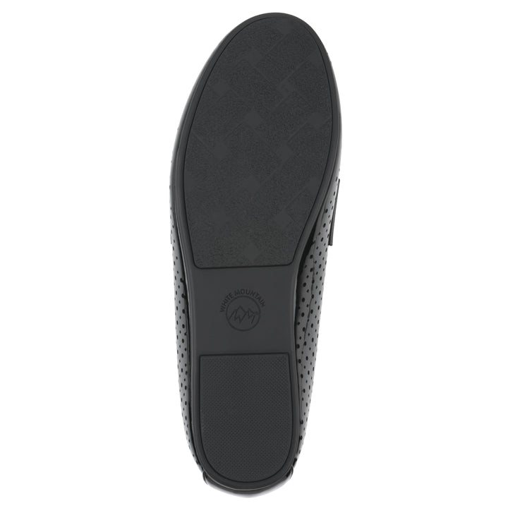 Sole view of a black patent perforated loafer shoe 