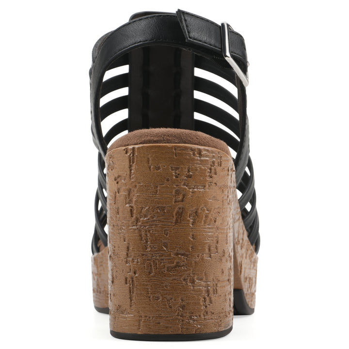Rear view of a black gladiator platform sandal with adjustable ankle buckle and cork style heel