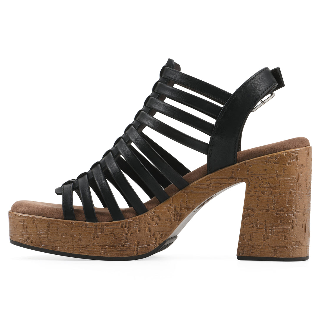 Side view of a black gladiator platform sandal with adjustable ankle buckle and cork style heel