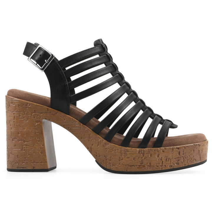 Side view of a black gladiator platform sandal with adjustable ankle buckle and cork style heel