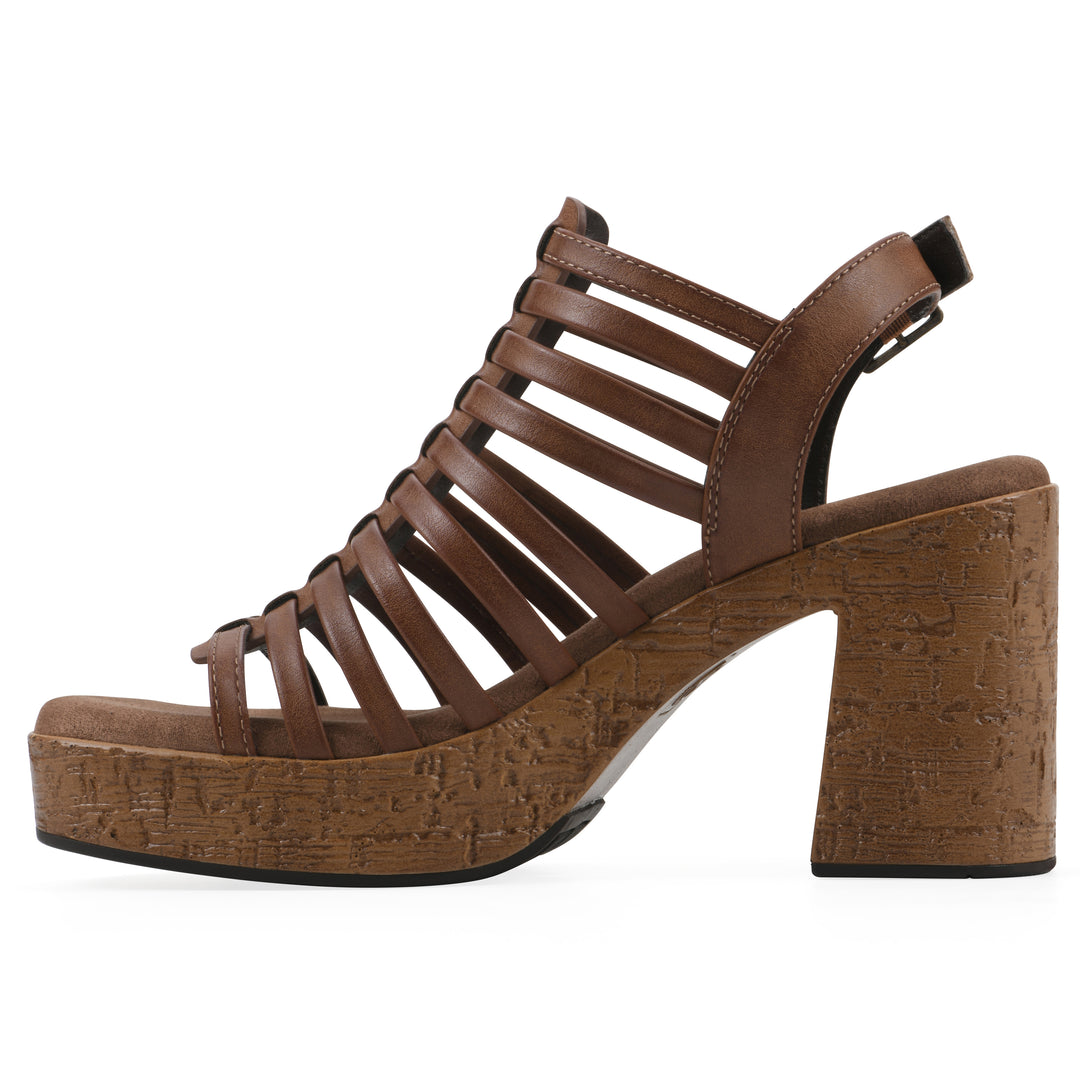 Side view of a brown gladiator platform sandal with adjustable ankle buckle and cork style heel