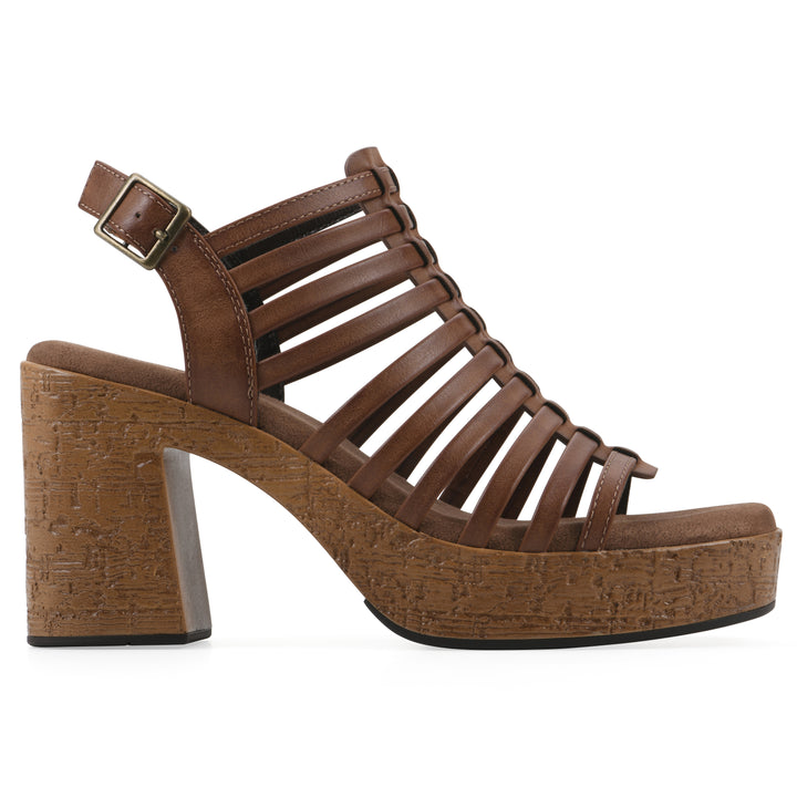 Side view of a brown gladiator platform sandal with adjustable ankle buckle and cork style heel