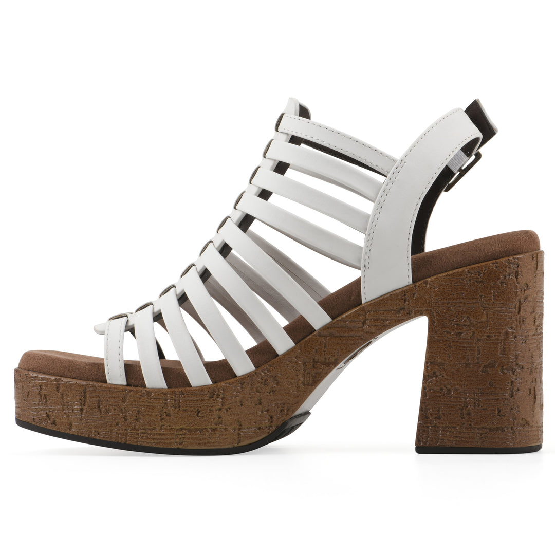 Side view of a white gladiator platform sandal with adjustable ankle buckle and cork style heel