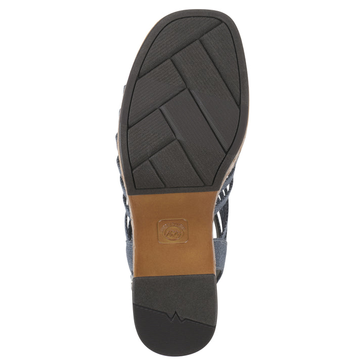 Sole view of a denim gladiator platform sandal with adjustable ankle buckle and cork style heel