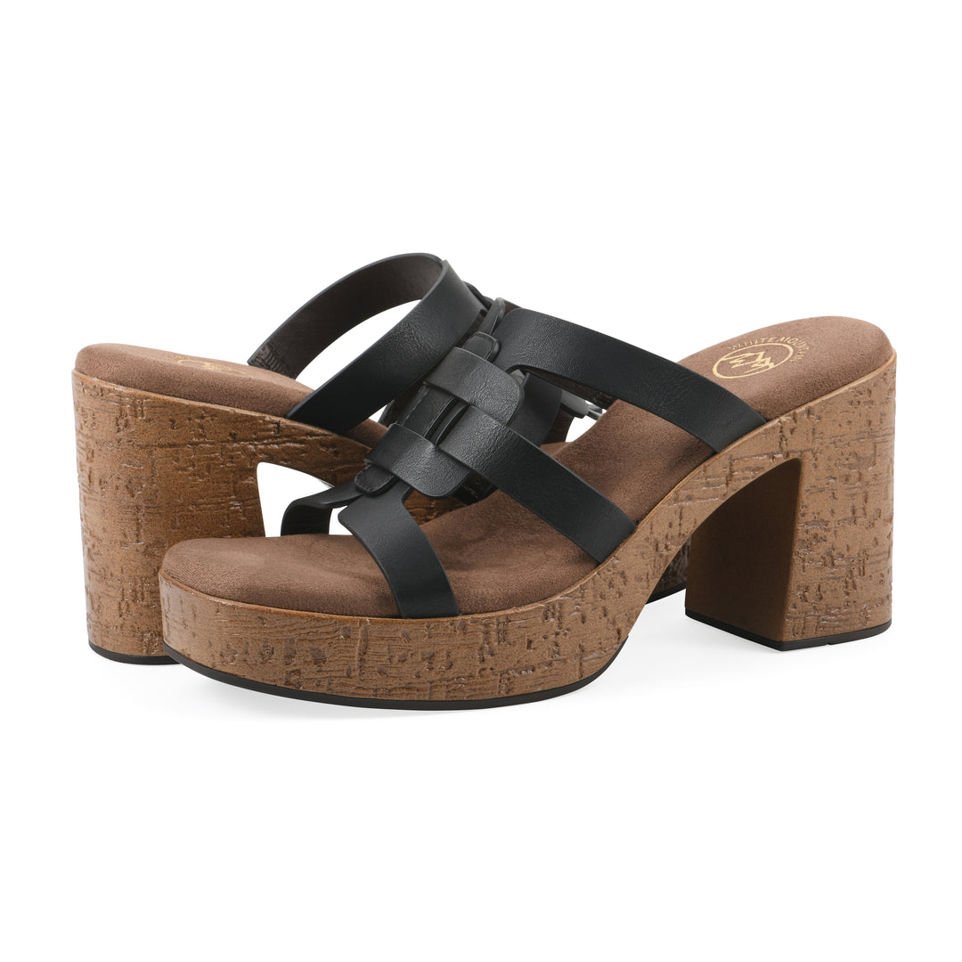 Angle view of a pair of black faux leather platform sandals, with multi-interlaced straps and a brown cork style sole