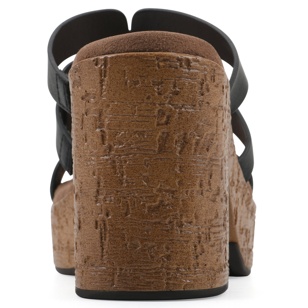 Rear view of a black faux leather platform sandal, with multi-interlaced straps and a brown cork style sole
