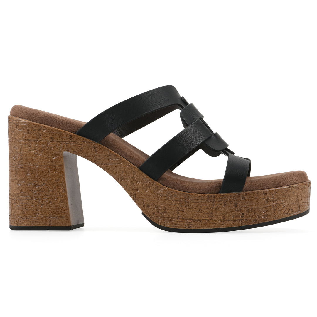 Side view of a black faux leather platform sandal, with multi-interlaced straps and a brown cork style sole