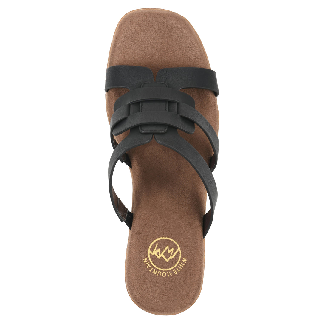 Top view of a black faux leather platform sandal, with multi-interlaced straps and a brown cork style sole