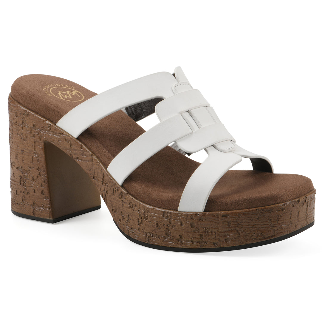 Angle view of a white faux leather platform sandal, with multi-interlaced straps and a brown cork style sole